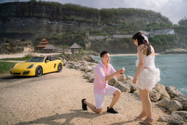 Bali proposal with sport car at melasti beach of Pandu & Thertia